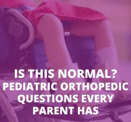 child in wheelchair with braces on feet