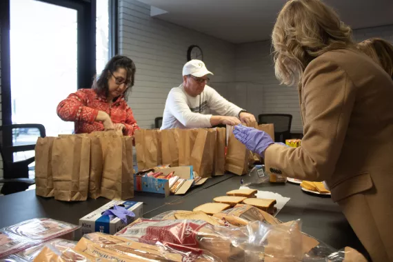 Social Responsibility: People making sandwiches 